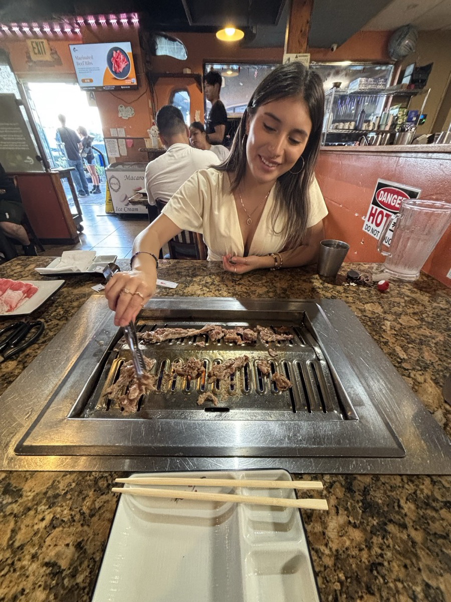 Susana grilling at korean bbq